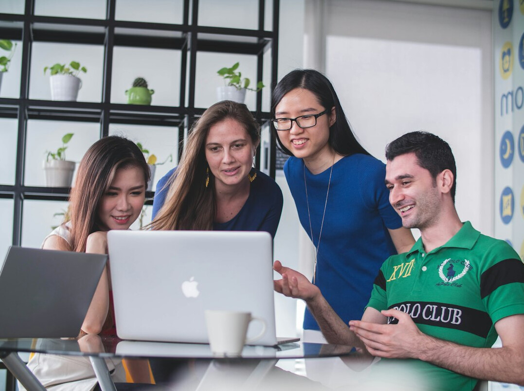 team discussing insurance tech
