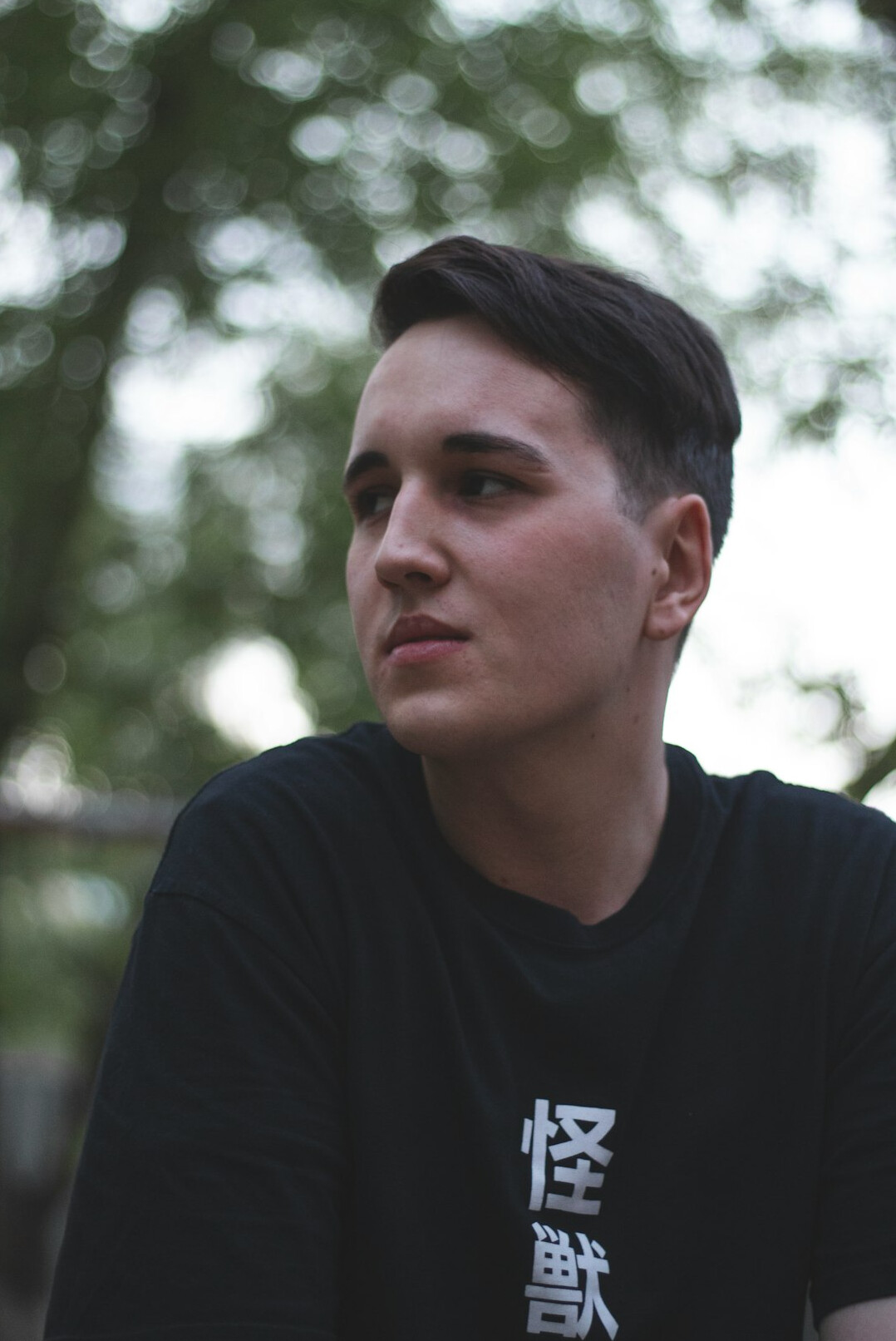 Man with short hair in a dark shirt portrait