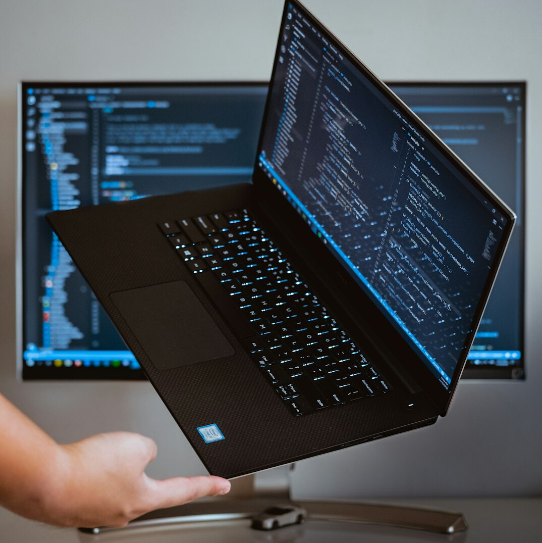 developer coding on laptop